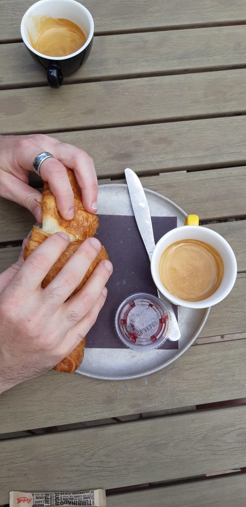 hands with croissants