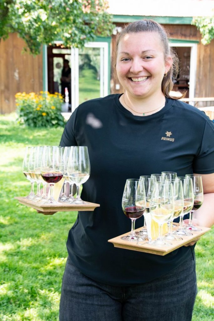 employee bringing wine tastings on food tour